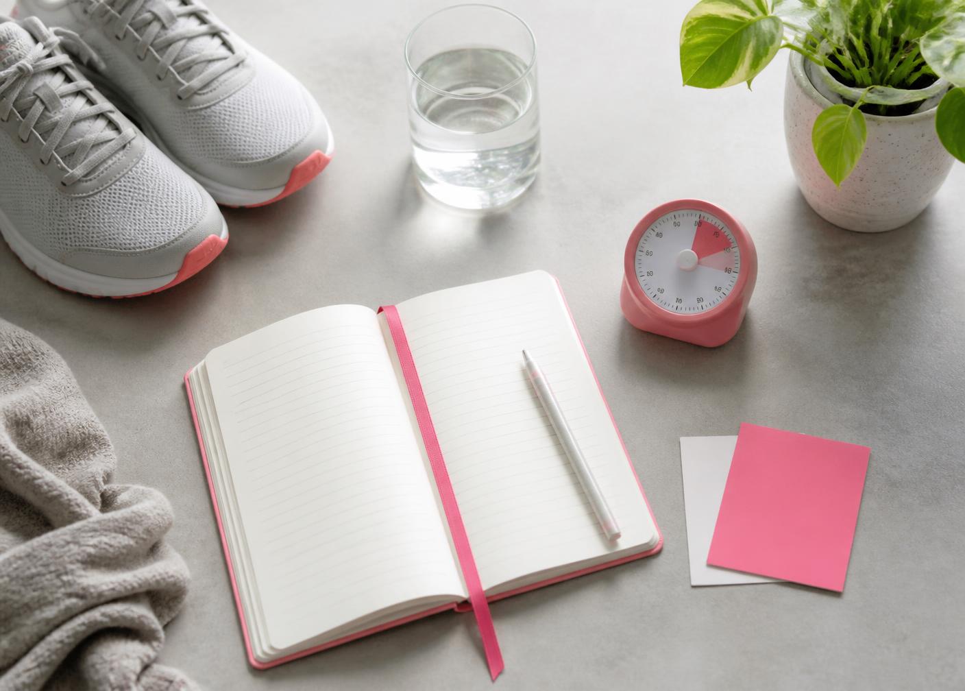 A journal, timer and walking shoes prepared for a simple daily practice